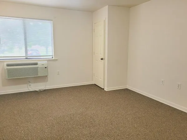 a view of an empty room with a window