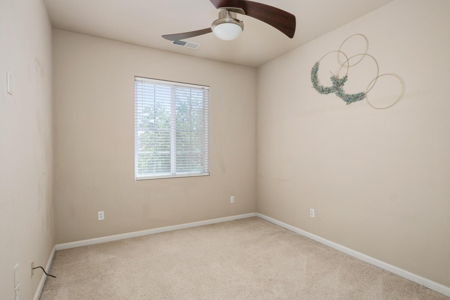 1182 Carson Avenue Clovis, CA 93611 - Photo 29 of 38 an empty room with a window
