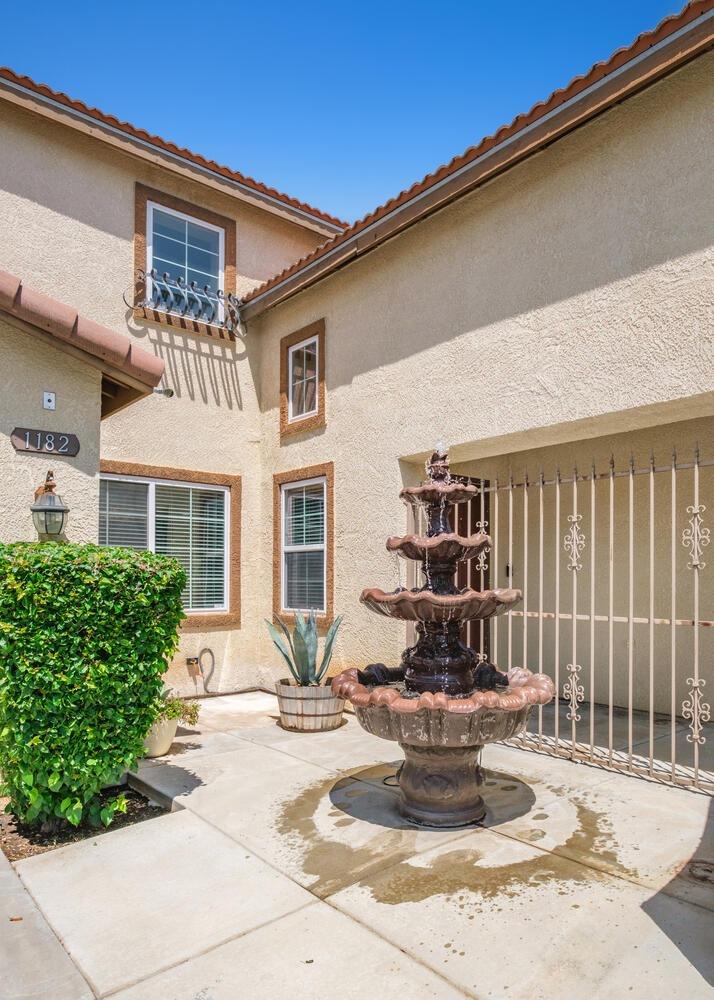 1182 Carson Avenue Clovis, CA 93611 - Photo 3 of 38 a view of a house with a bench in patio