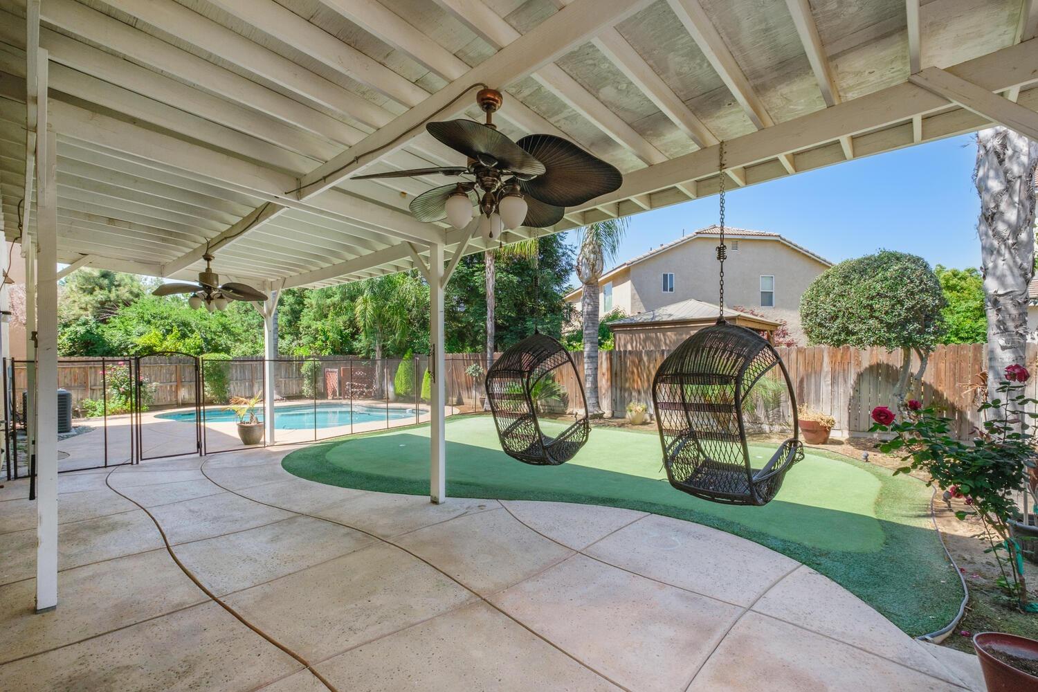 1182 Carson Avenue Clovis, CA 93611 - Photo 31 of 38 a view of a porch with a garden