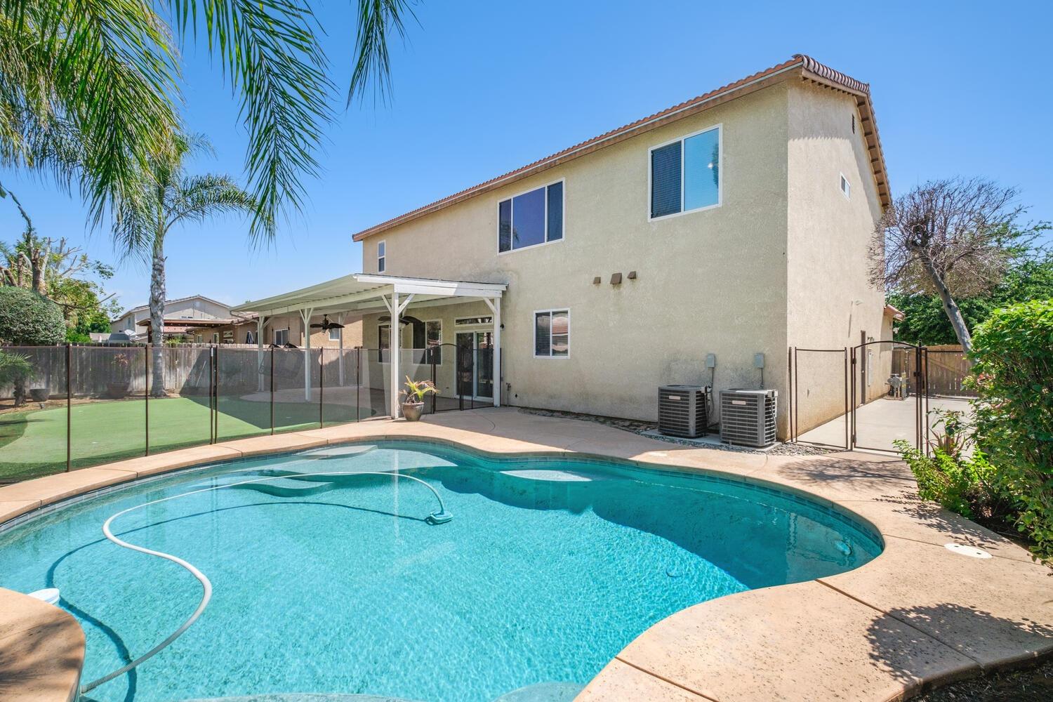 1182 Carson Avenue Clovis, CA 93611 - Photo 34 of 38 a view of a house with backyard and sitting area