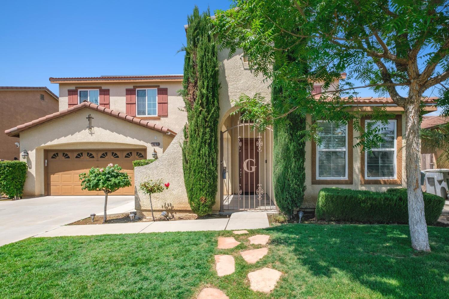 1182 Carson Avenue Clovis, CA 93611 - Photo 4 of 38 front view of a house with a yard