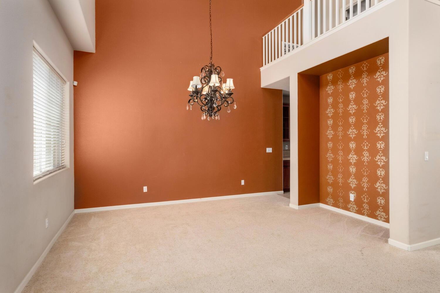 1182 Carson Avenue Clovis, CA 93611 - Photo 8 of 38 a view of a chandelier with a chandelier and a window