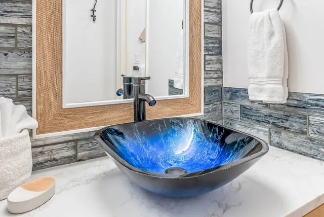 a view of a bathroom with bathtub and window