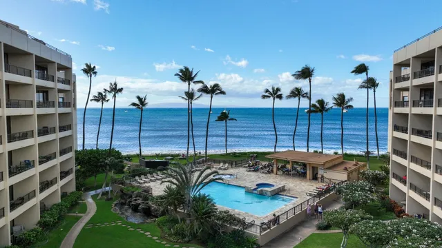 a view of a backyard with sitting area