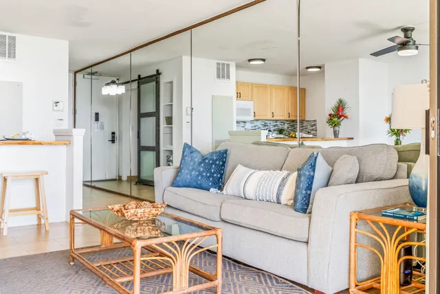 a living room with furniture and a chandelier