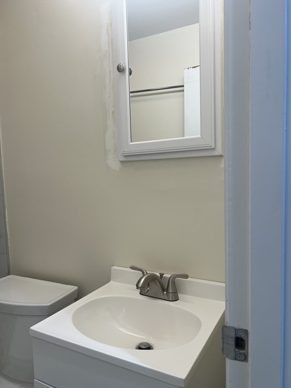 50 Main Street Medway, MA 02053 - Photo 18 of 23 a bathroom with a sink and a window