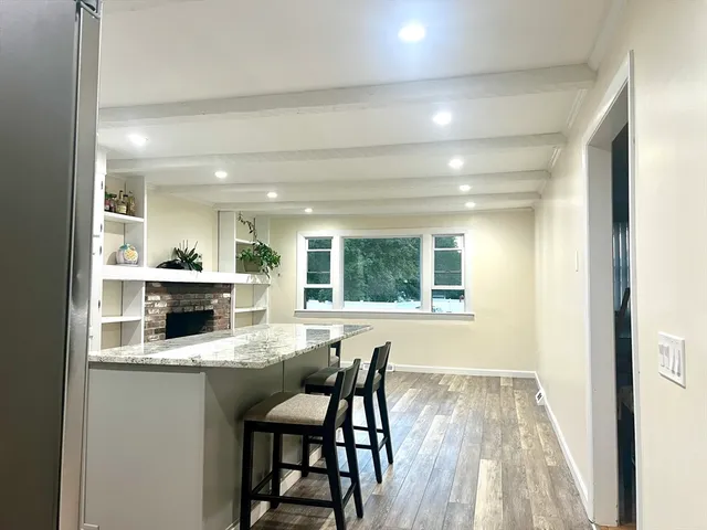 a kitchen with a table and chairs in it