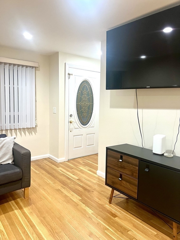 50 Main Street Medway, MA 02053 - Photo 5 of 23 a living room with furniture and a flat screen tv