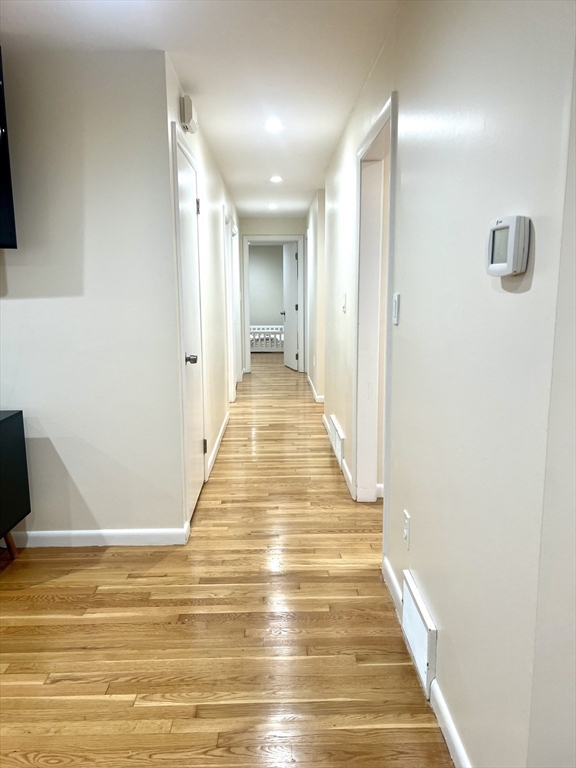 50 Main Street Medway, MA 02053 - Photo 9 of 23 a view of a hallway with wooden floor and staircase