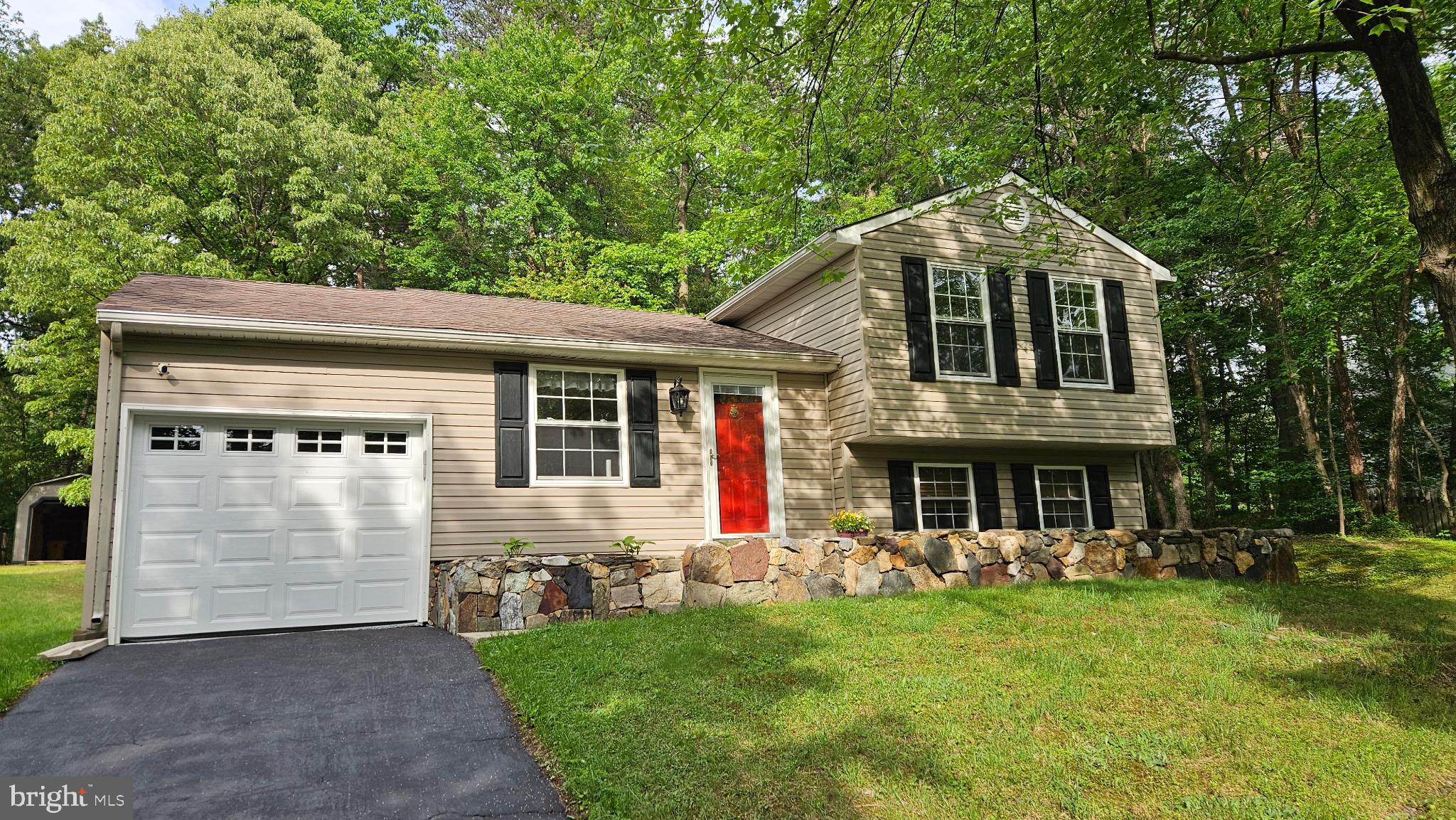 357 Council Oak Drive Severn, MD 21144 - Photo 2 of 37 a front view of a house with a yard