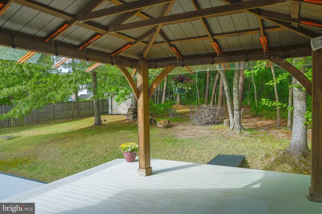 a view of a backyard with a small cabin