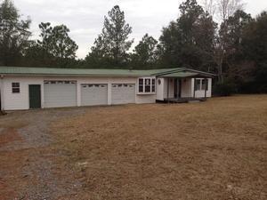 1201 Tallokas Road Crestview, FL 32536 - Photo 1 of 34 front view of a house with a yard
