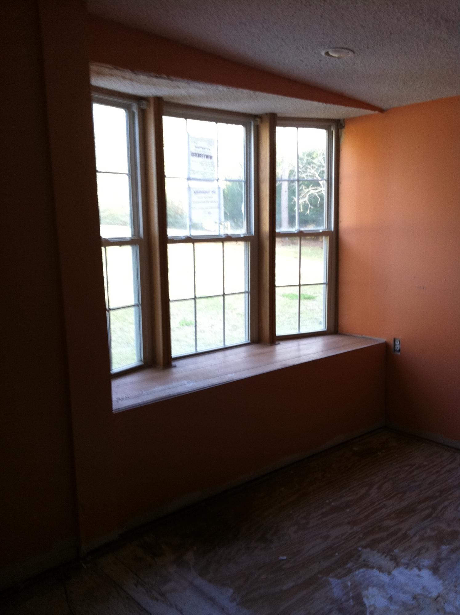 1201 Tallokas Road Crestview, FL 32536 - Photo 13 of 34 a room with wooden floor and a window