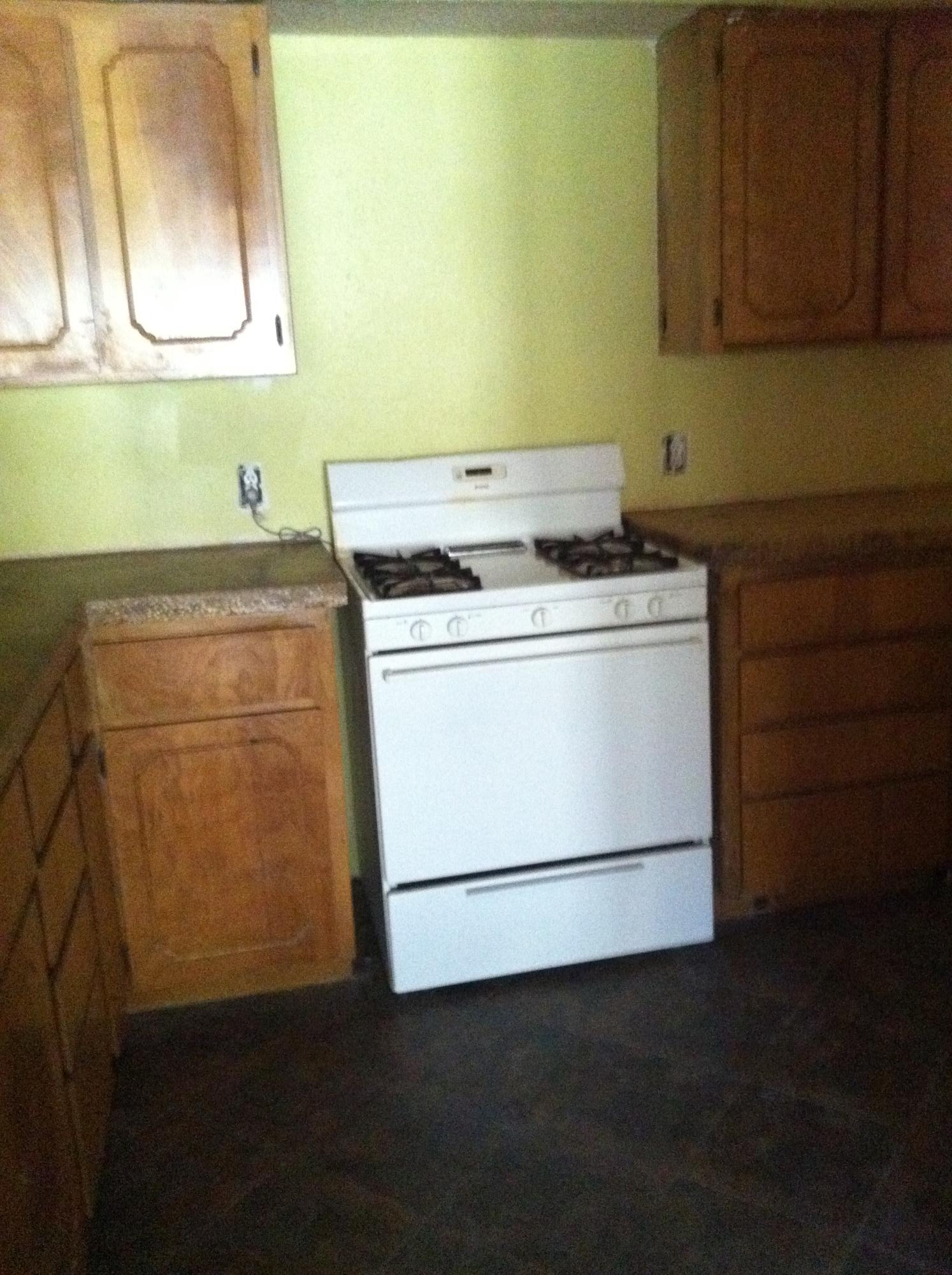 1201 Tallokas Road Crestview, FL 32536 - Photo 21 of 34 a stove top oven sitting inside of a kitchen