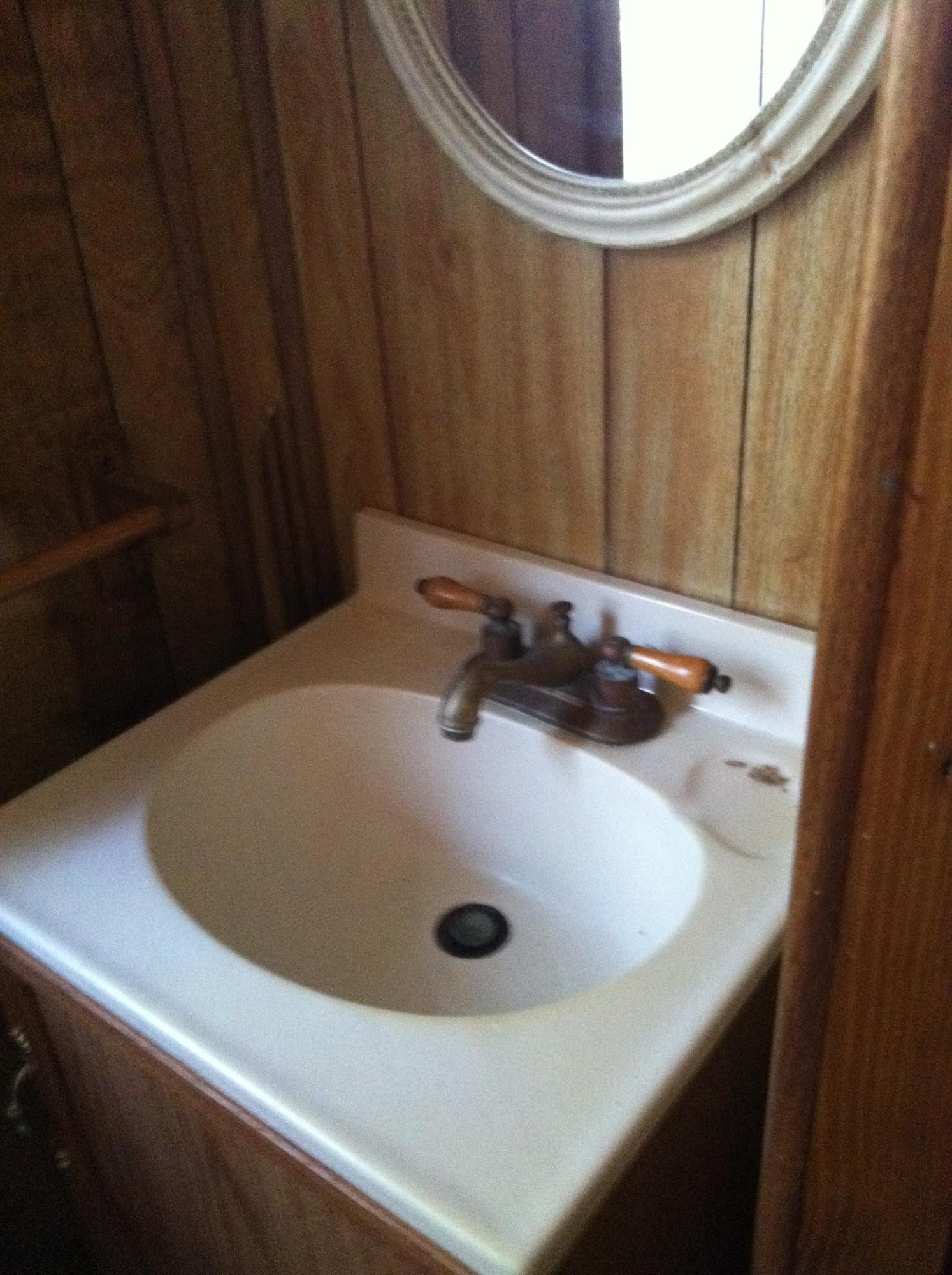1201 Tallokas Road Crestview, FL 32536 - Photo 22 of 34 a bathroom with a sink