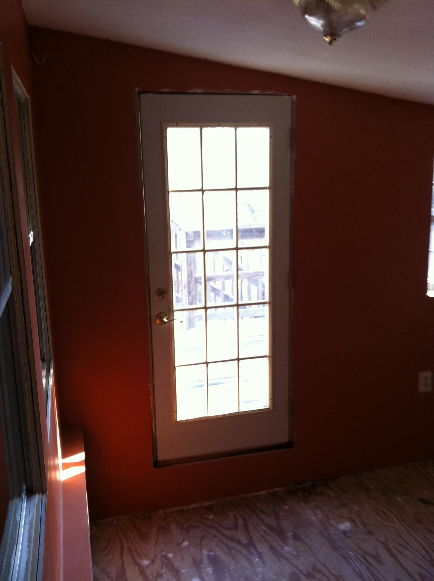 1201 Tallokas Road Crestview, FL 32536 - Photo 23 of 34 an empty room with wooden floor and windows