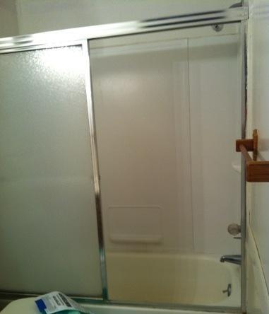 1201 Tallokas Road Crestview, FL 32536 - Photo 6 of 34 a bathroom with a glass shower door