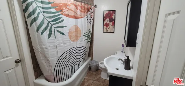 a view of a porch with wooden floor