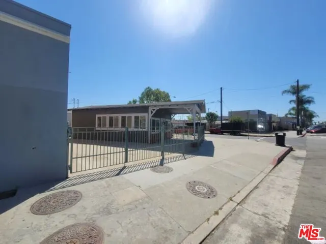 a view of a patio with a table and chairs