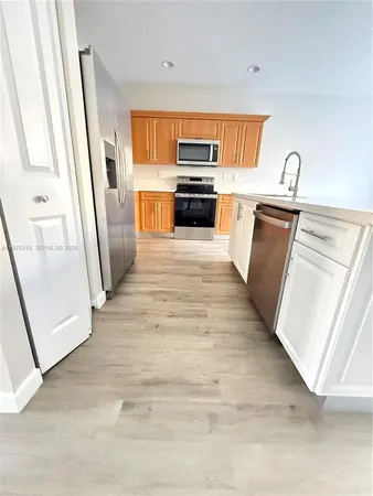 a view of a livingroom with wooden floor