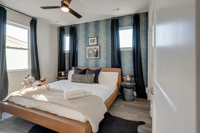 a bedroom with a bed and a window