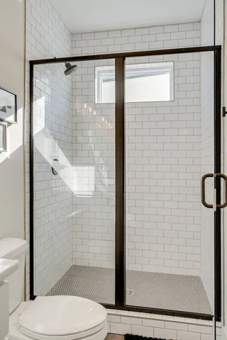 a view of a patio with table and chairs with wooden floor and fence