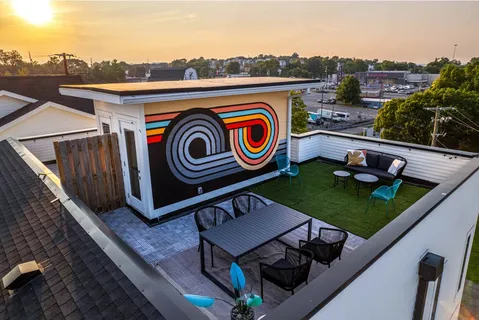 a view of a terrace with seating space and city view