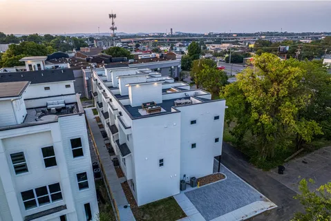 a aerial view of a house with a yard