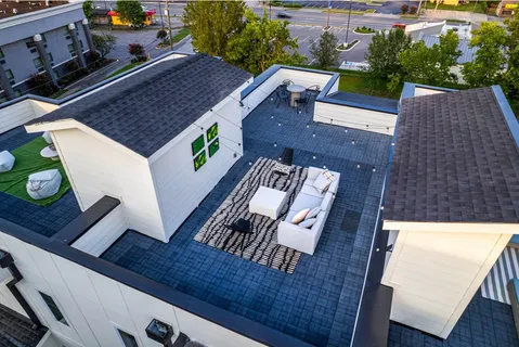 a living room with furniture and kitchen view