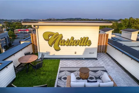 an aerial view of a house with roof deck