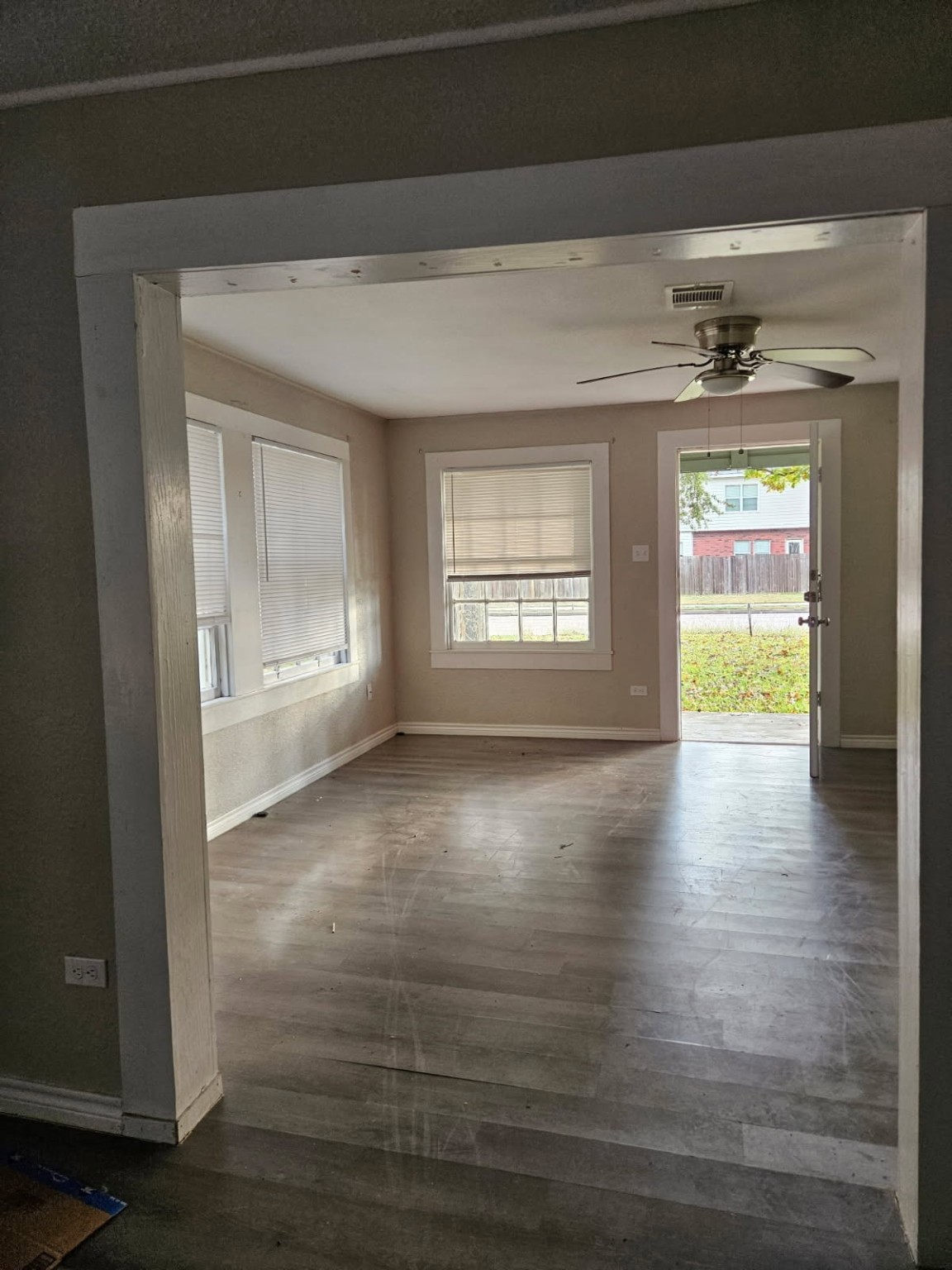 311 South Amburn Road Texas City, TX 77591 - Photo 3 of 7 a view of empty room with wooden floor and fan