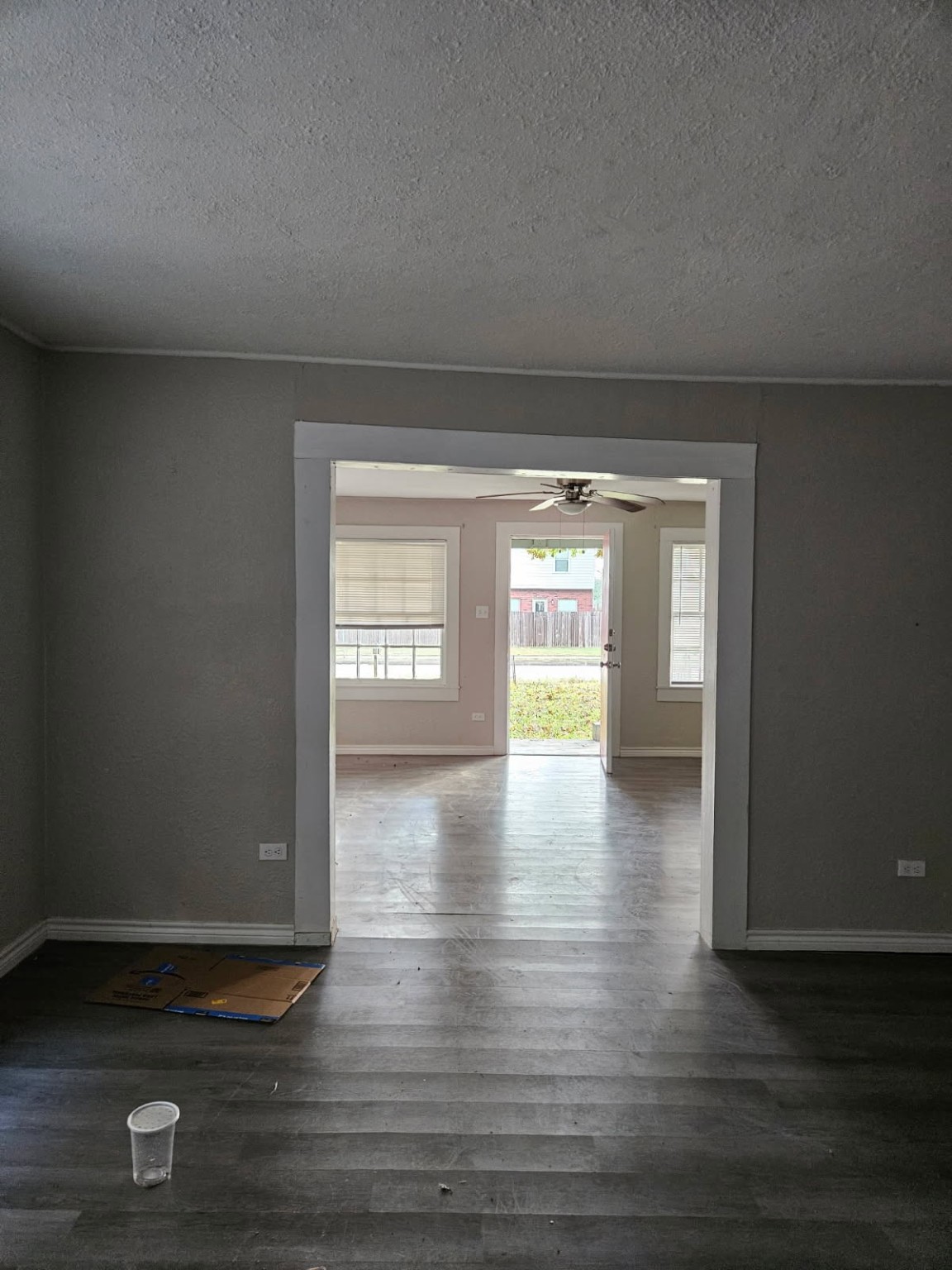 311 South Amburn Road Texas City, TX 77591 - Photo 6 of 7 a view of empty room with window and wooden floor