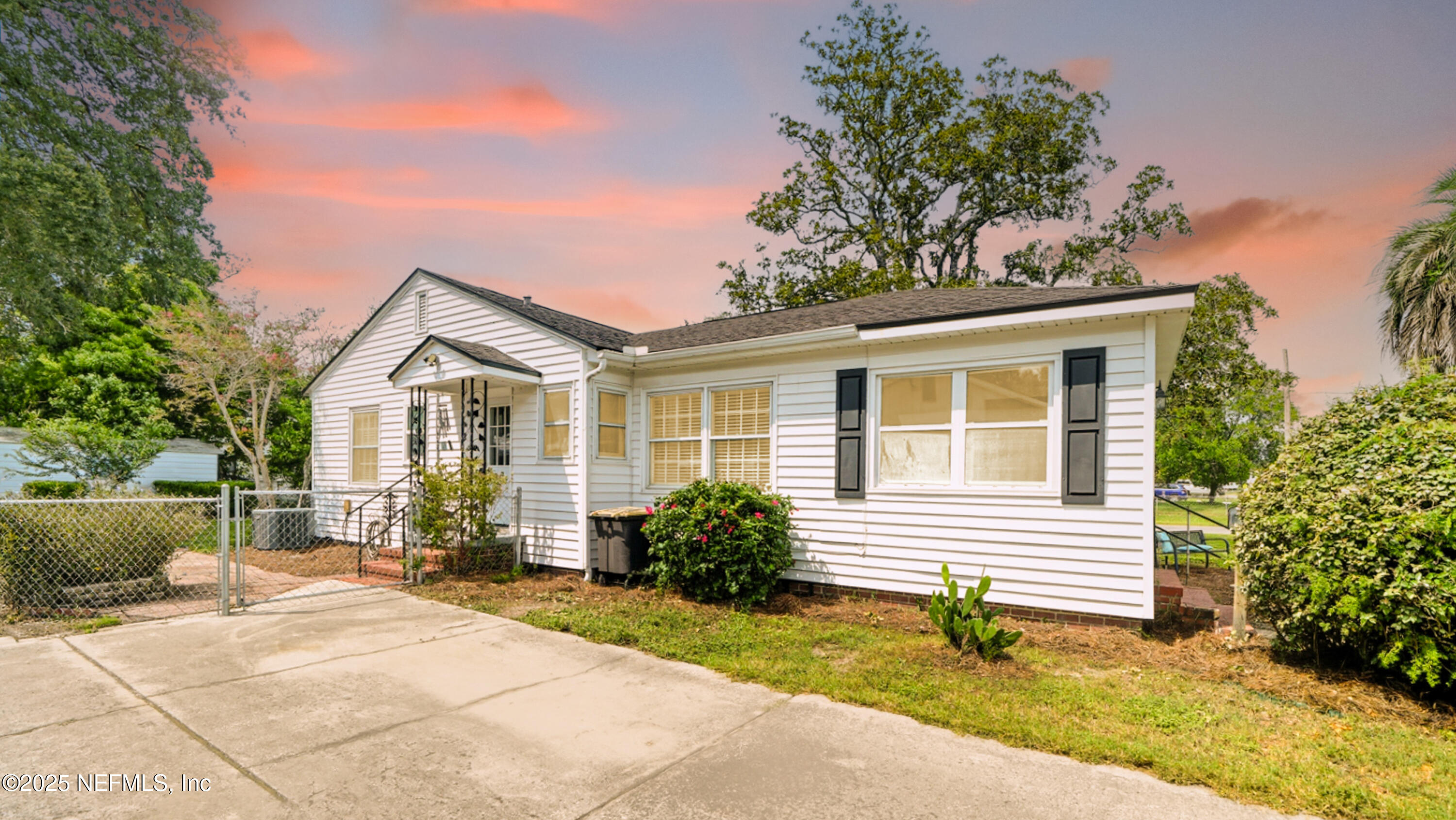 2604 Bayview Road Jacksonville, FL 32210 - Photo 1 of 31 a front view of a house with a yard