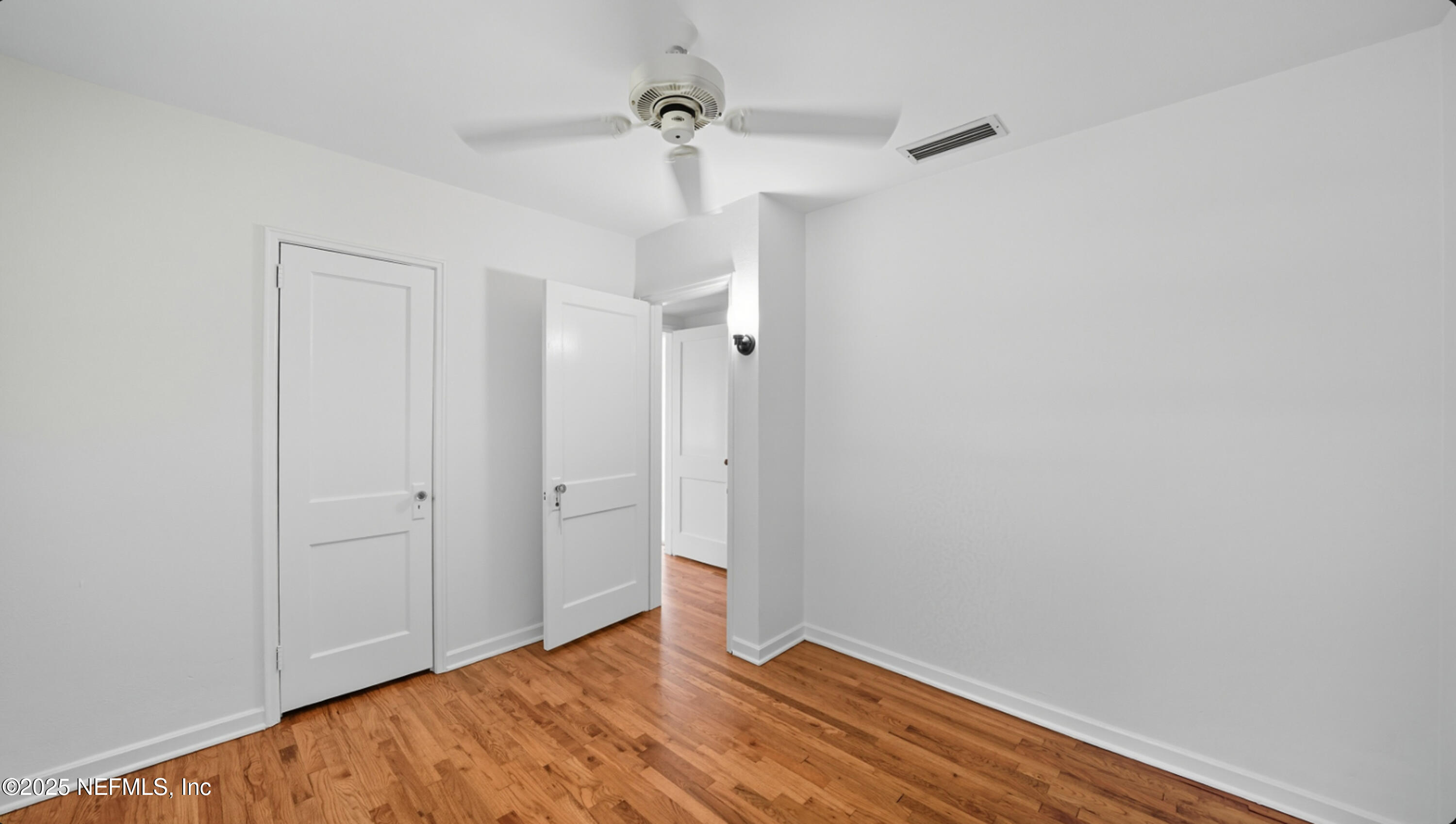 2604 Bayview Road Jacksonville, FL 32210 - Photo 16 of 31 a view of empty room with wooden floor