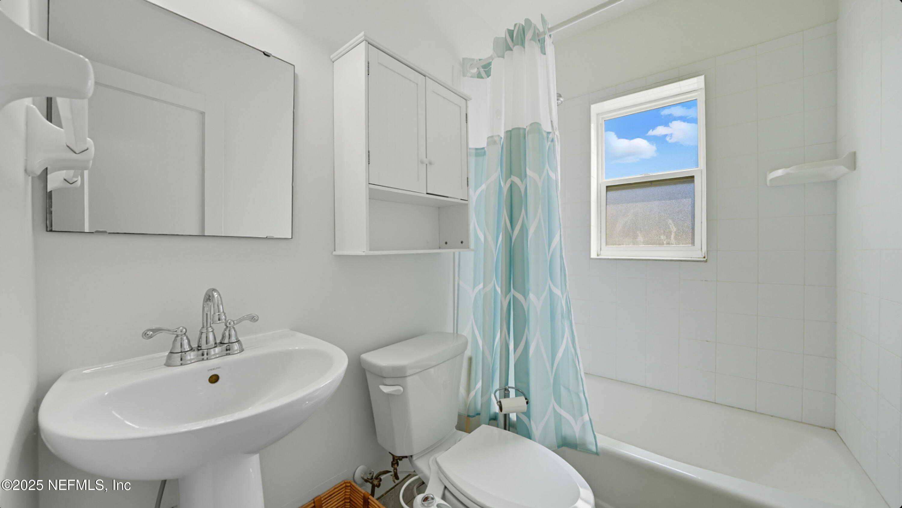 2604 Bayview Road Jacksonville, FL 32210 - Photo 17 of 31 a bathroom with a sink toilet and shower