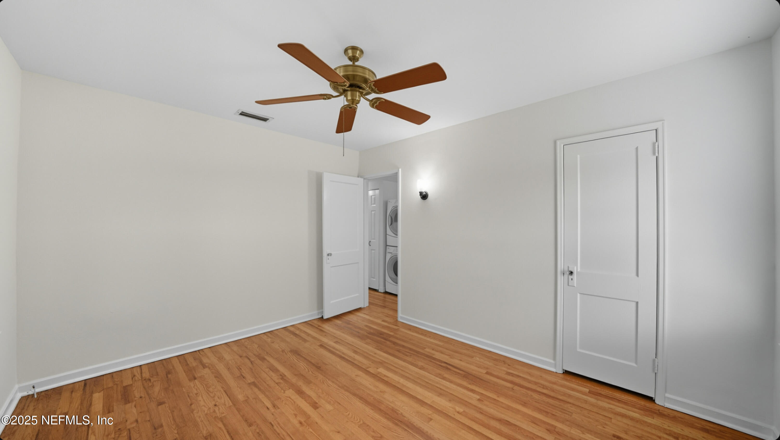 2604 Bayview Road Jacksonville, FL 32210 - Photo 19 of 31 a view of empty room with wooden floor