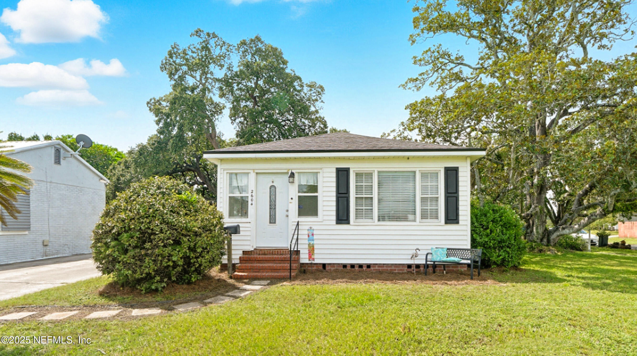 2604 Bayview Road Jacksonville, FL 32210 - Photo 2 of 31 a front view of a house with a garden