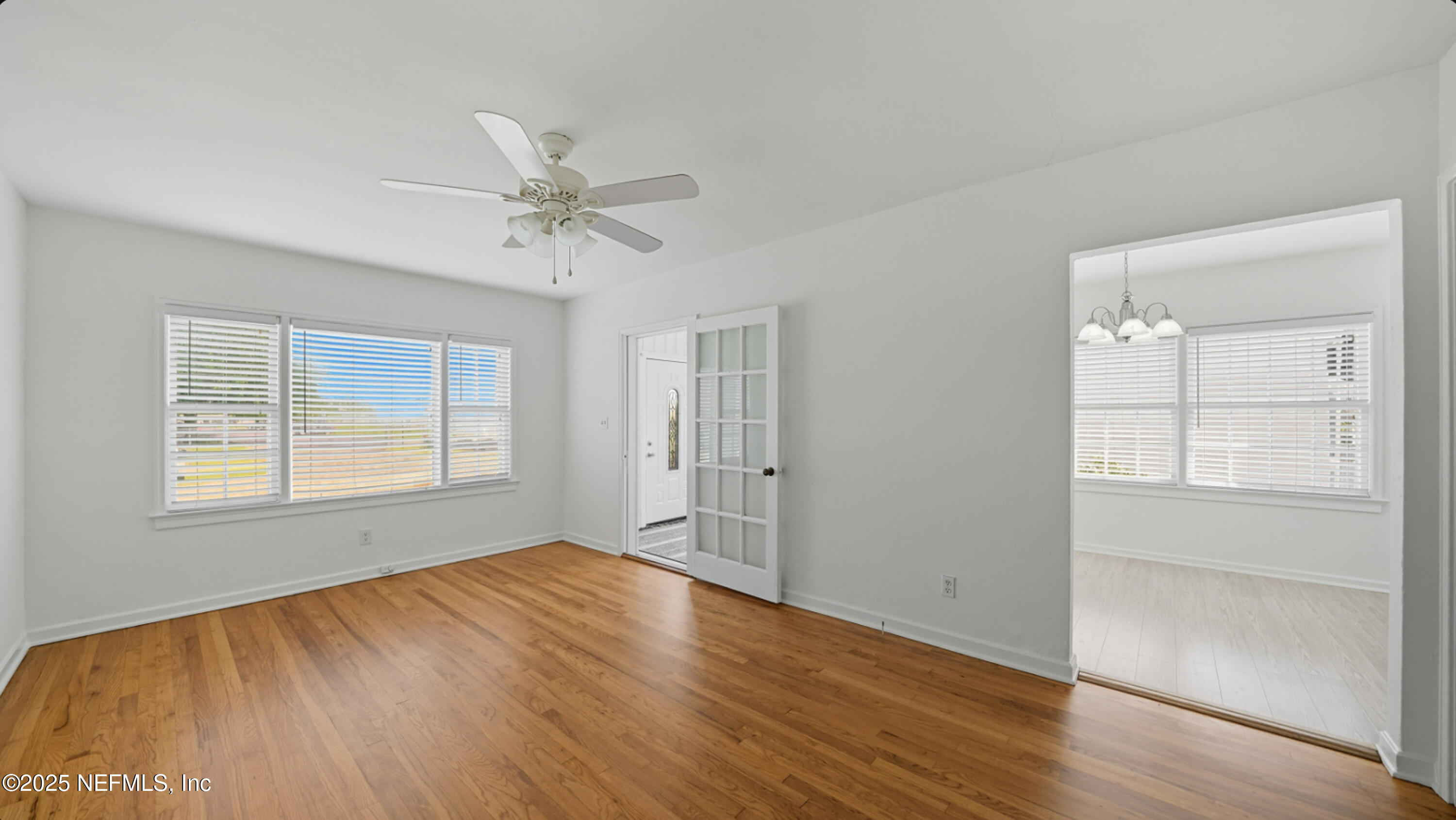 2604 Bayview Road Jacksonville, FL 32210 - Photo 6 of 31 wooden floor in an empty room with a window