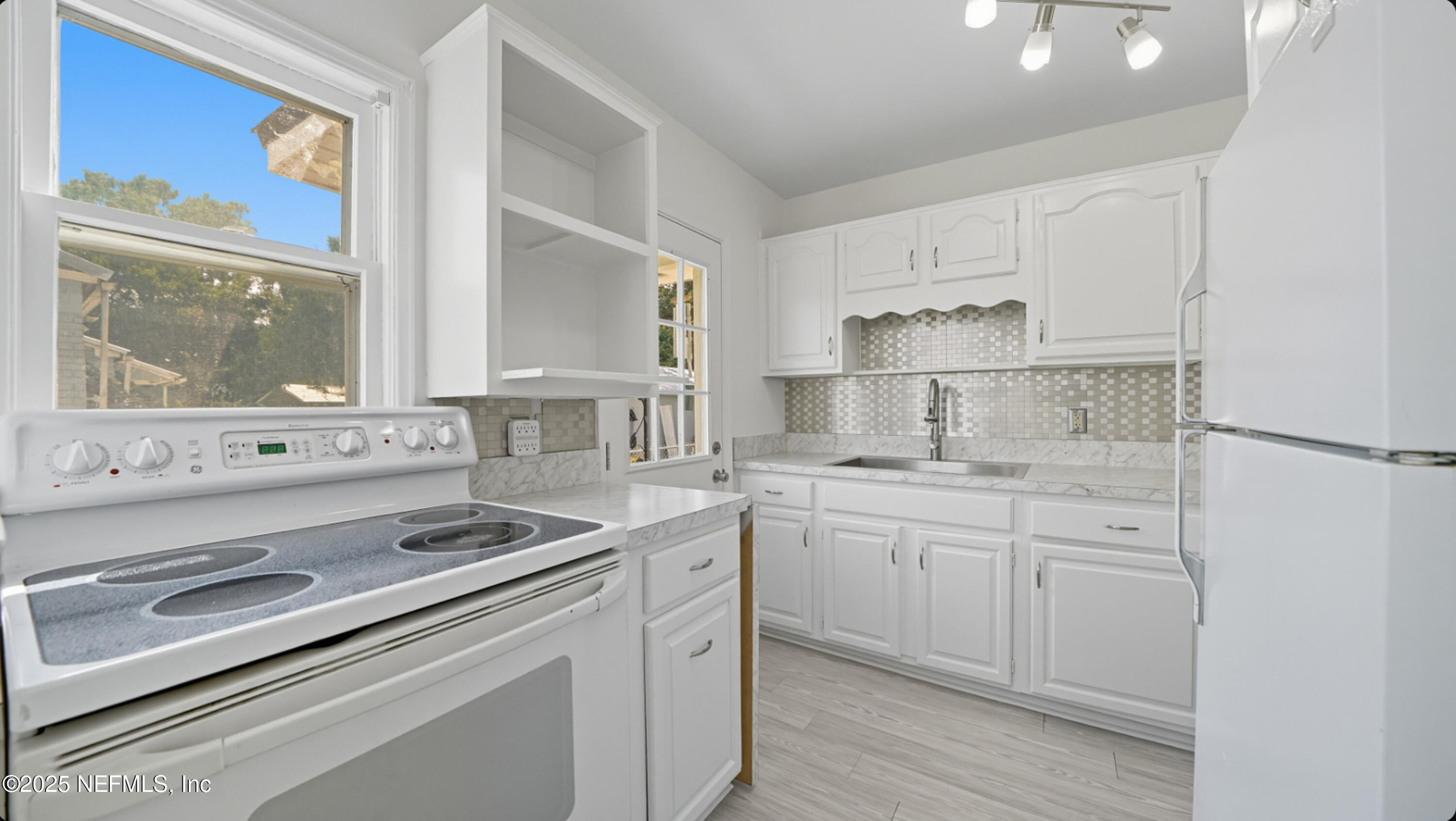 2604 Bayview Road Jacksonville, FL 32210 - Photo 9 of 31 a kitchen with appliances cabinets and a sink