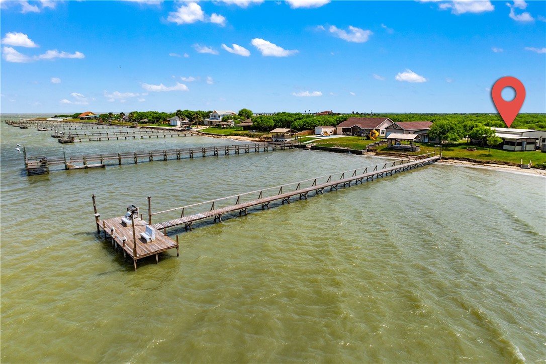 1356 Neubauer Point Road Riviera, TX 78379 - Photo 18 of 40 a view of a lake with lawn chairs