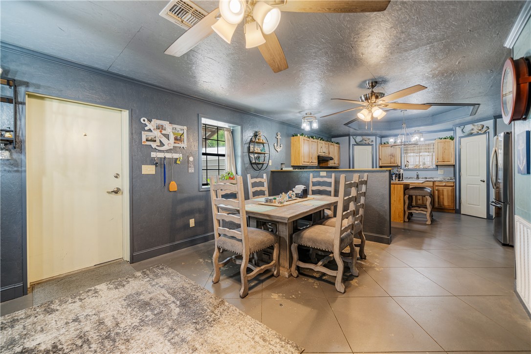 1356 Neubauer Point Road Riviera, TX 78379 - Photo 20 of 40 a view of a dining room with furniture