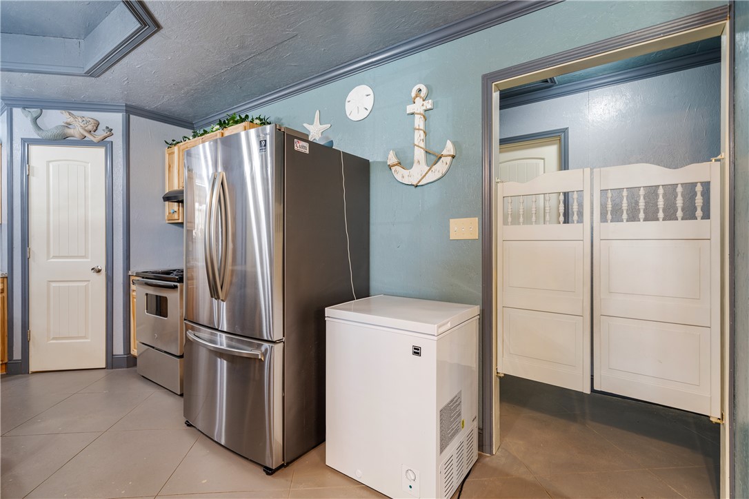1356 Neubauer Point Road Riviera, TX 78379 - Photo 28 of 40 a kitchen with stainless steel appliances a refrigerator and a refrigerator