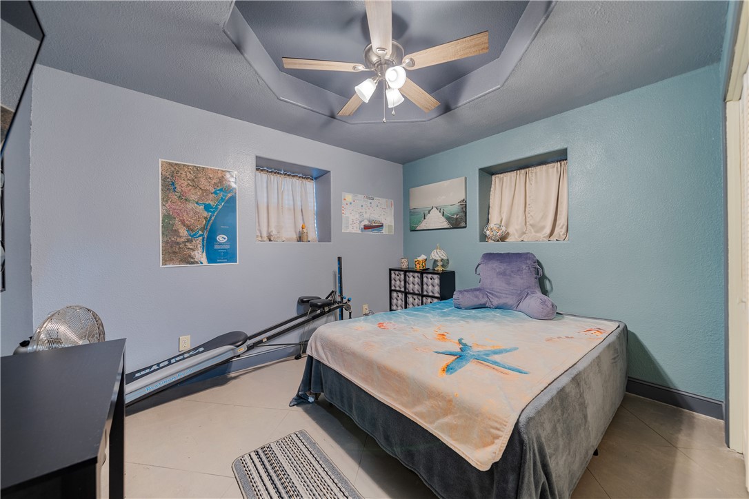 1356 Neubauer Point Road Riviera, TX 78379 - Photo 31 of 40 a large bed sitting in a bedroom next to a window