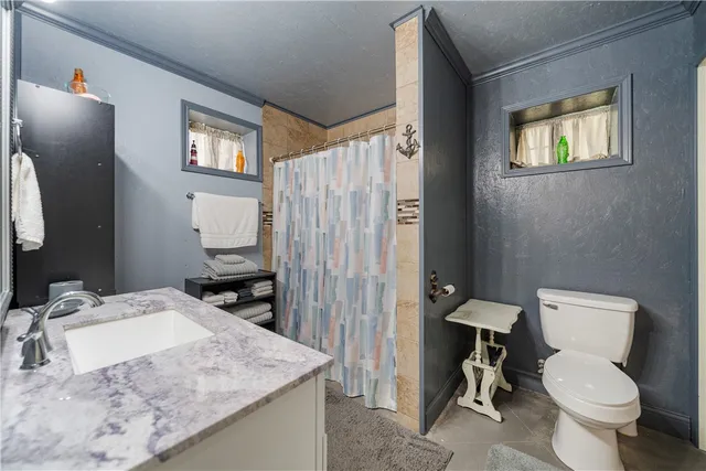 a bathroom with a toilet and a sink