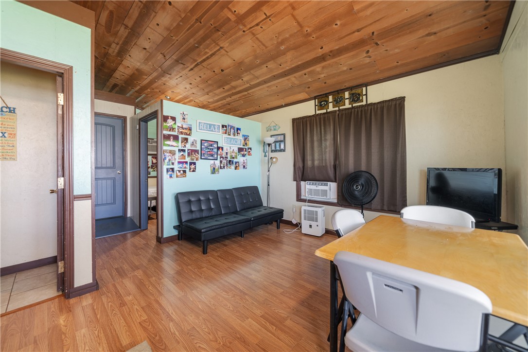 1356 Neubauer Point Road Riviera, TX 78379 - Photo 40 of 40 a bedroom with furniture and a wooden floor