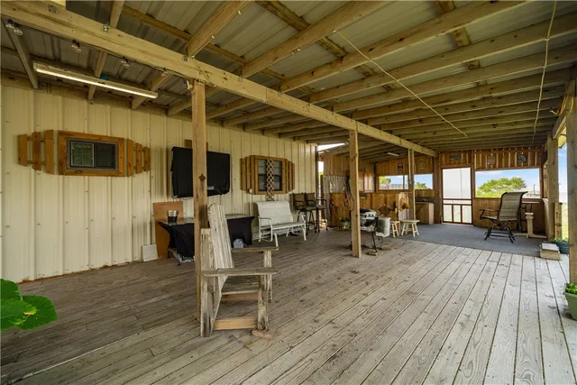 a view of a porch with wooden floor