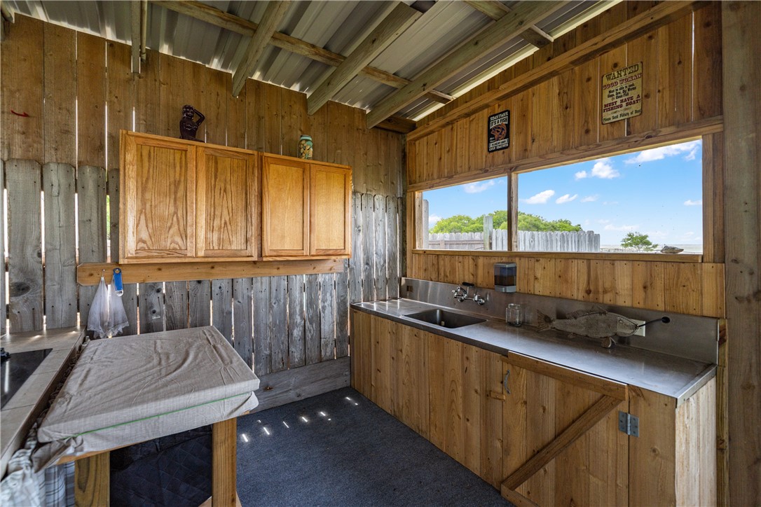 1356 Neubauer Point Road Riviera, TX 78379 - Photo 7 of 40 a kitchen with a sink and a window