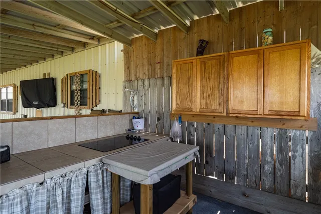 a bathroom with a sink a mirror and shower