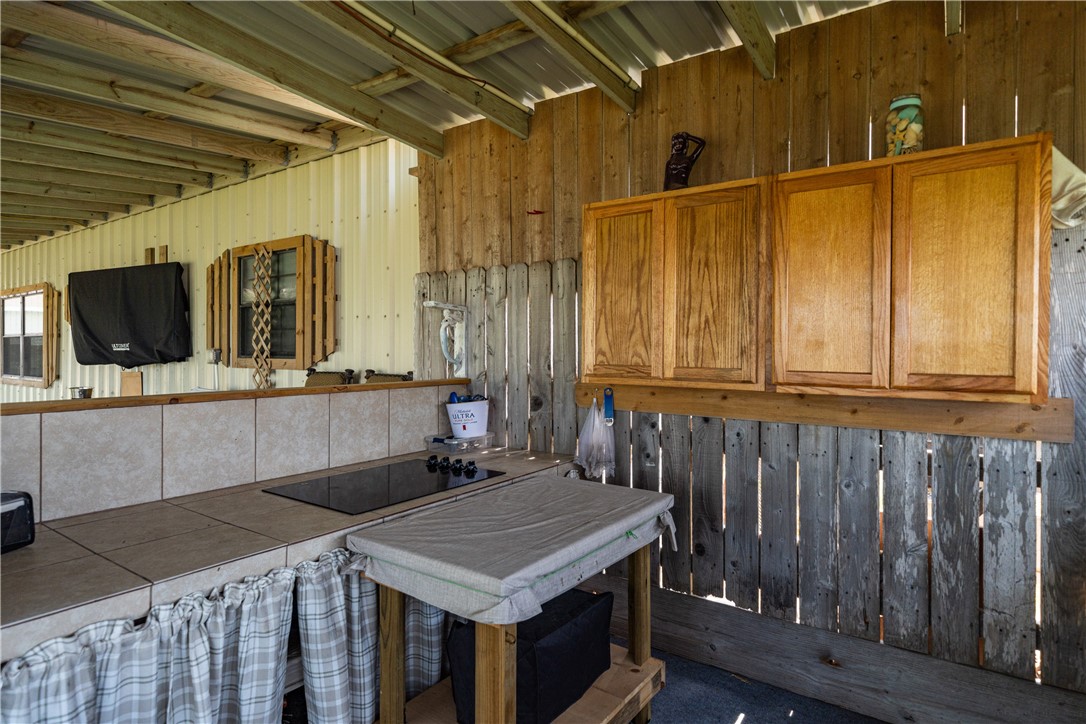 1356 Neubauer Point Road Riviera, TX 78379 - Photo 8 of 40 a bathroom with a sink a mirror and shower